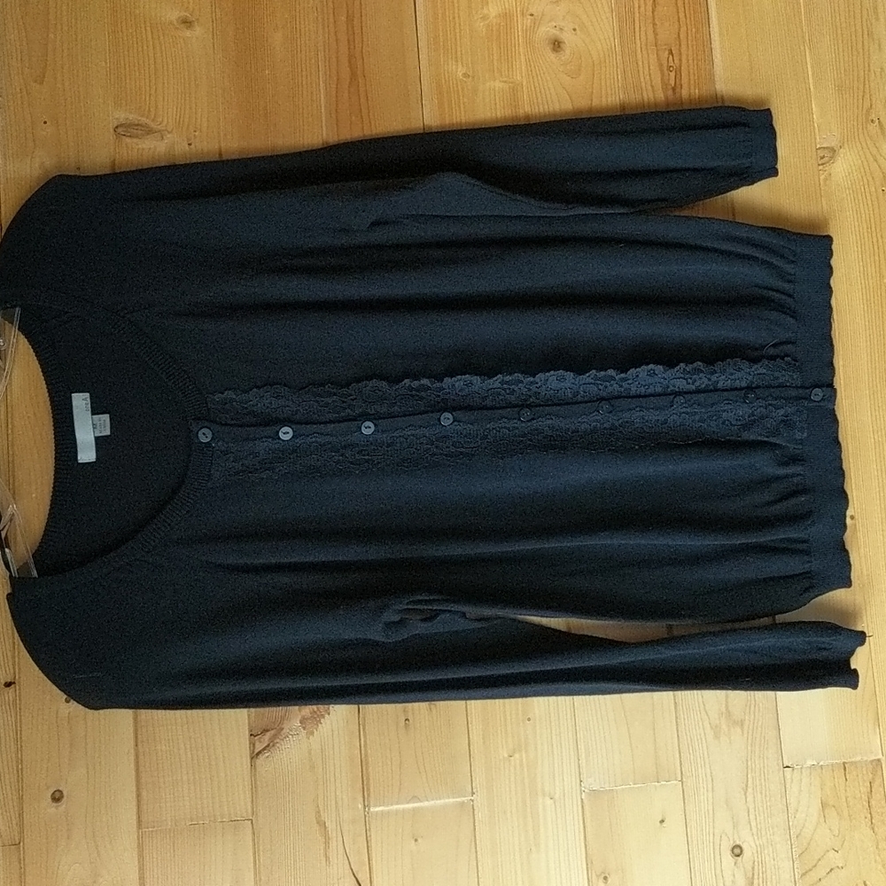 One A: black cardigan with lace along buttons.